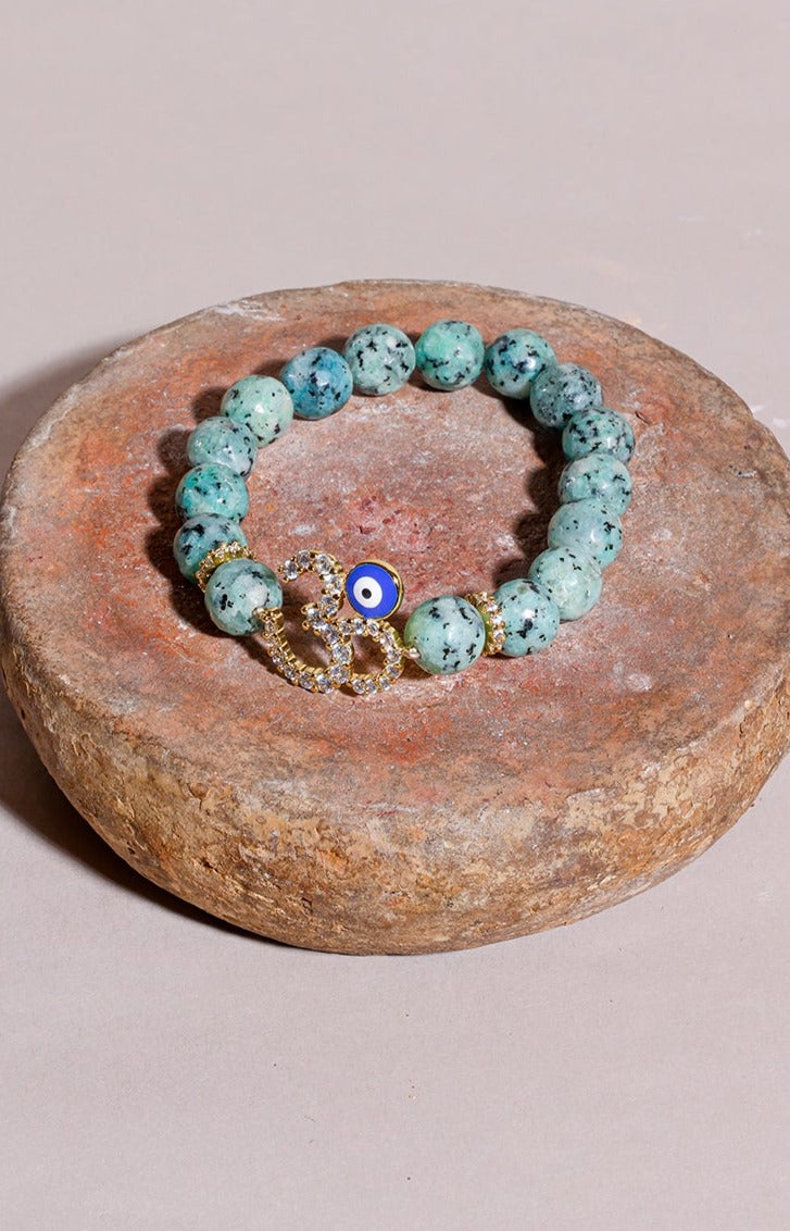 Load image into Gallery viewer, Turquoise Beads Om Rakhi
